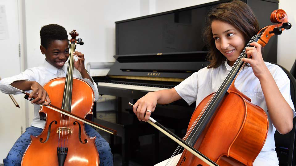 Two RCMJD students in a cello lesson